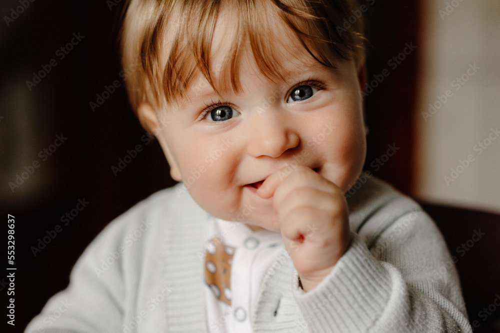 portrait of adorable baby with finger in mouth portrait of adorable baby with finger in mouth