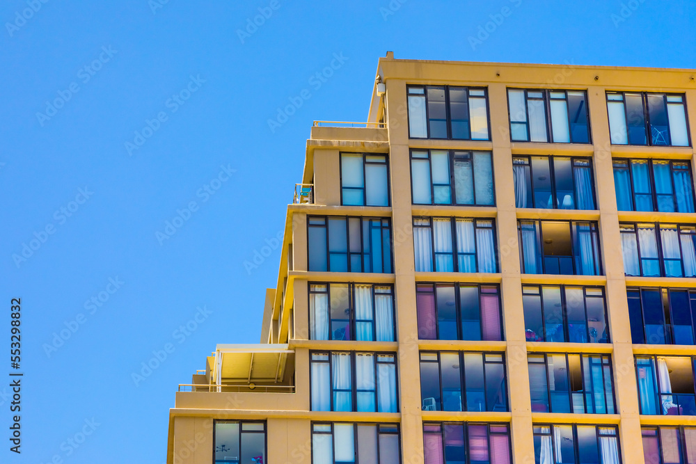 Modern contemporary apartment condo building with glass facade