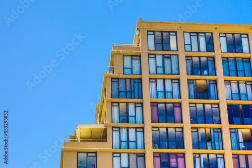 Modern contemporary apartment condo building with glass facade