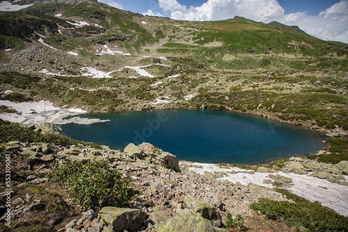 Alpine Lake in Caucasus Mountains photo