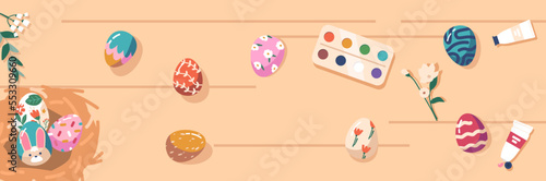 Colorful Easter Eggs on Wooden Table with Paints and Chicken Nest Top View. Preparation for Traditional Spring Holiday