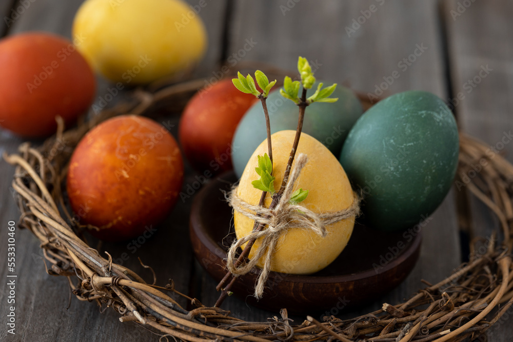 Easter eggs coloured with natural organic colorants: red cabbage, curcuma, onion peel. Handmade home decor, natural elements, eco-friendly, zero waste. Dark wooden background