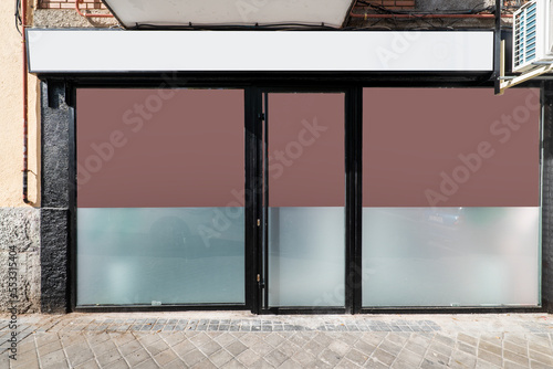 Konstfotografi Facade of a commercial premises seen from the cobbled street
