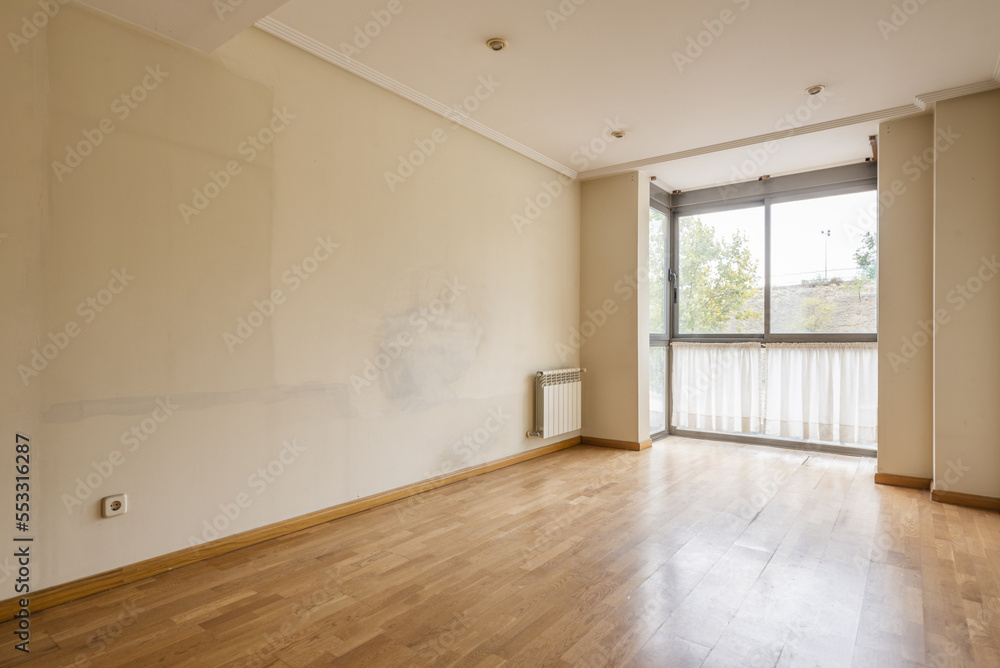 custom made wallpaper toronto digitalAn empty room with walls full of marks from the old furniture and a bay window with curtains at the bottom