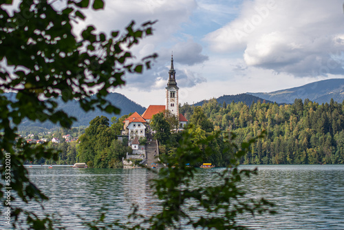 bled church among the leaves of the trees