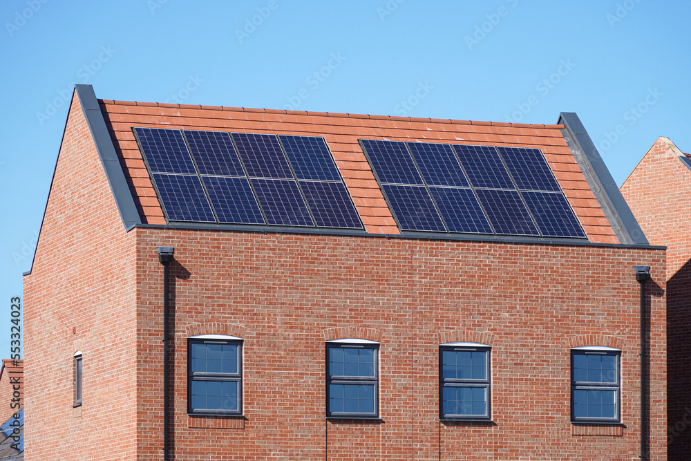 New modern apartment buildings with solar panels on the roof in London UK