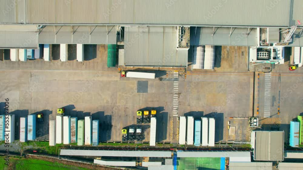 4K : Aerial view from a drone flying over a many cargo containers and Semi-trailer trucks at distribution center. import and export industry. logistics and transportation concept.
4K : Aerial view from a drone flying over a many cargo containers and Semi-trailer trucks at distribution center. import and export industry. logistics and transportation concept.