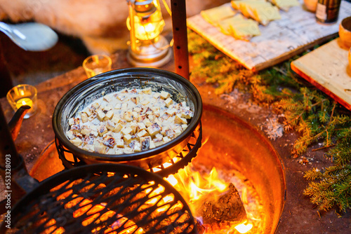Foto Lappish baked cheese being cooked over open fire