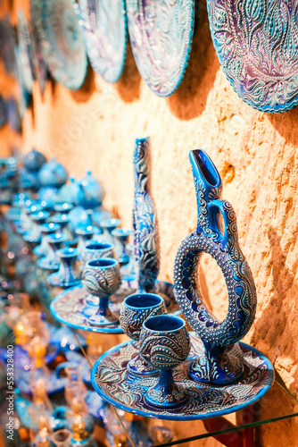 Colorful hittite wine jug and glasses photo