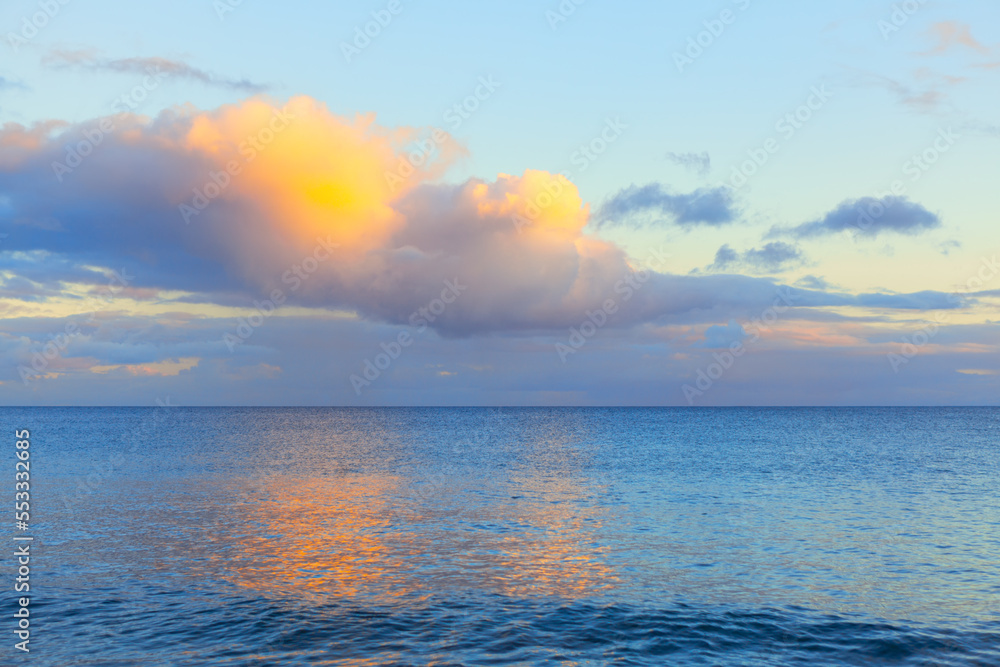 Colorful clouds over the ocean . Twilight reflection in the seawater