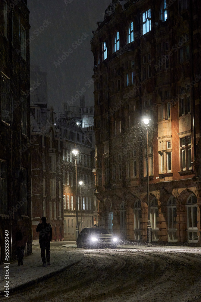 London in snow at night in December 
