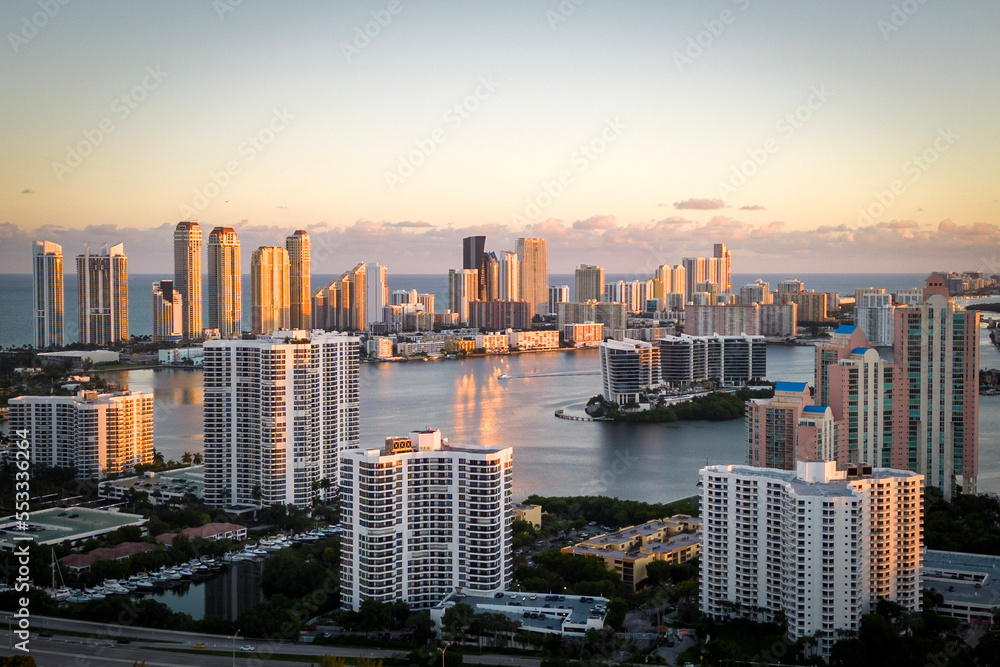 Sunny Isles city skyline at sunset with a warm glow