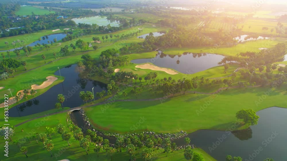 Drone flying over golf course in the morning with sunshine. Golf is a sport and hobby popular with the rich. meditative leisure activities. summer day. green background. 4K
Drone flying over golf course in the morning with sunshine. Golf is a sport and hobby popular with the rich. meditative leisure activities. summer day. green background. 4K