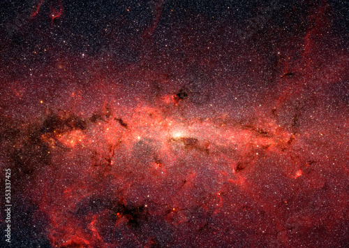 The center of the Milky Way's galaxy. Red clouds of obscuring dust and gas in outer space. Digitally enhanced. Elements of this image furnished by NASA. 