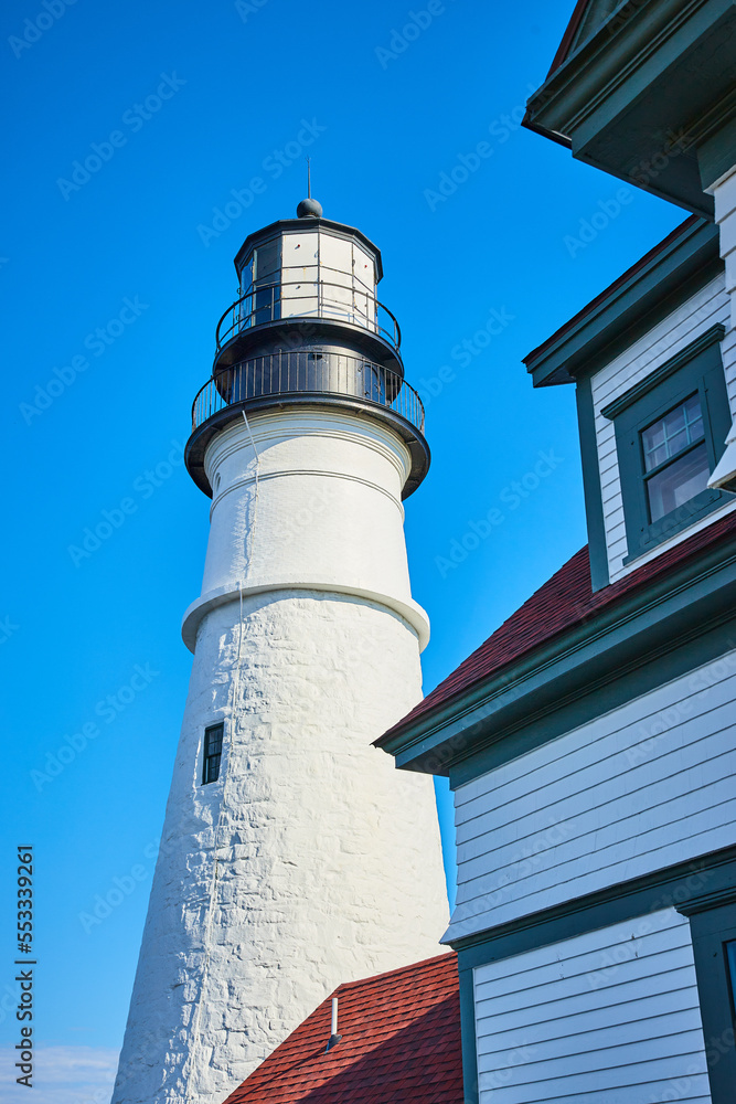 Detail of large white brick lighthouse from below Detail of large white brick lighthouse from below