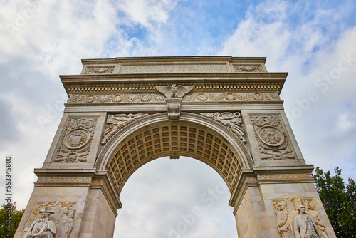 Top of Washington Square Park limestone arch looking up towards sky