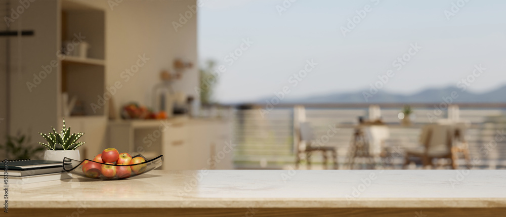 Copy space on marble kitchen tabletop with apple tray and decor over blurred kitchen with dining table Copy space on marble kitchen tabletop with apple tray and decor over blurred kitchen with dining table