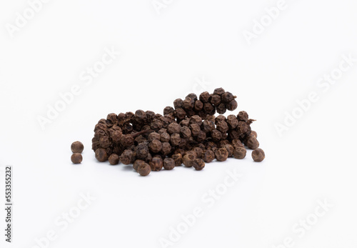 a pile of black pepper seeds food or seasoning Spices, ingredients of regular cooking in the kitchen of Asian, Indian, spicy, hot, natural herbs. pepper seeds isolated on white background