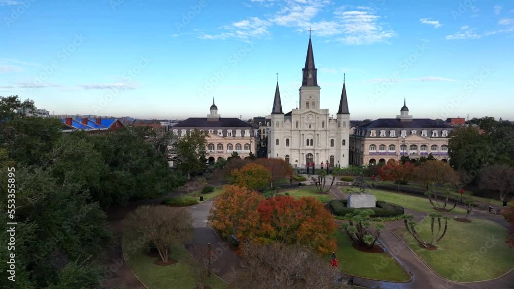St Louis Cathedral in NOLA. New Orleans Louisiana. Aerial truck shot reveals USA flag. Patriotic church state theme. St Louis Cathedral in NOLA. New Orleans Louisiana. Aerial truck shot reveals USA flag. Patriotic church state theme.
