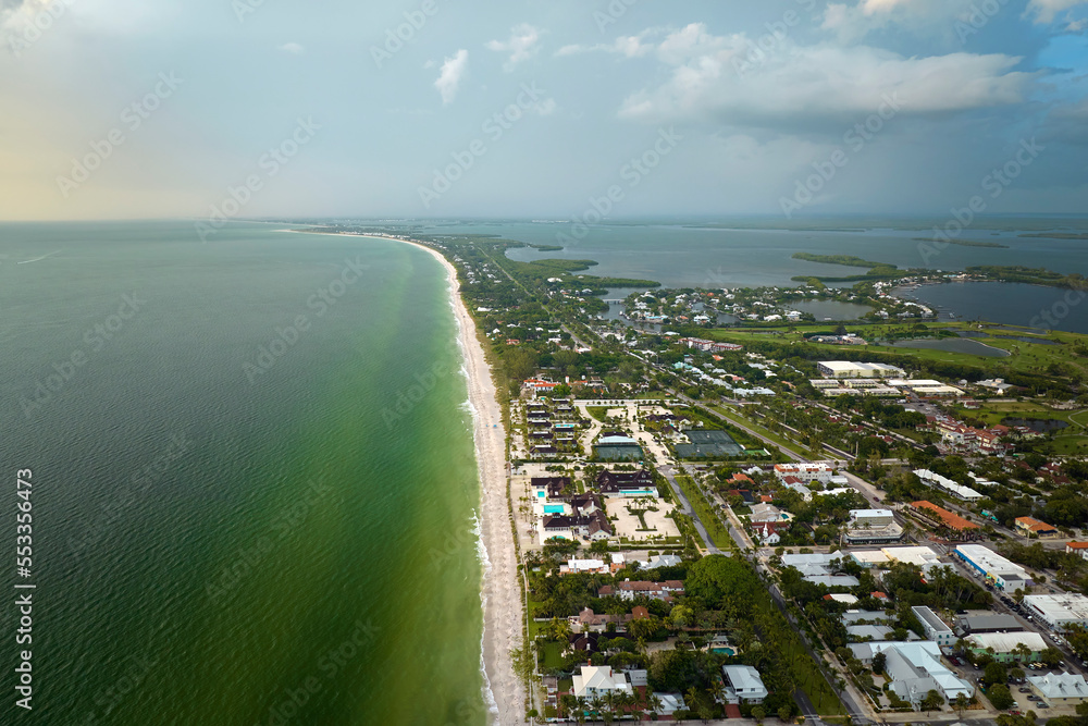 View from above of large residential houses in island small town Boca