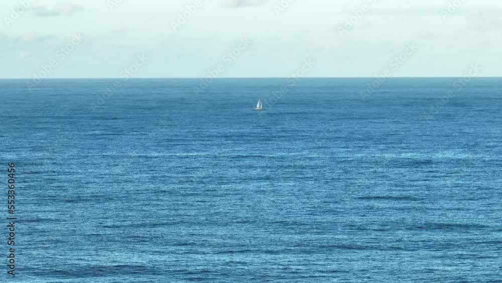 Aerial telephoto shot of single lone Sailing Yacht in ocean, at full sail. Shot off Gold Coast Australia Aerial telephoto shot of single lone Sailing Yacht in ocean, at full sail. Shot off Gold Coast Australia