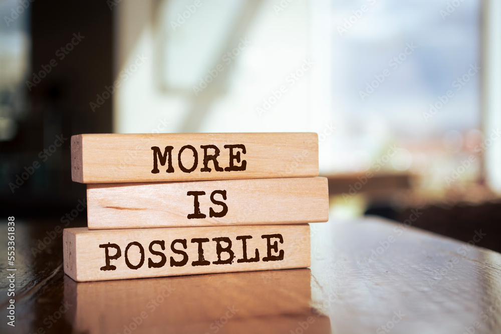 Wooden blocks with words 'More is Possible'. Wooden blocks with words 'More is Possible'.