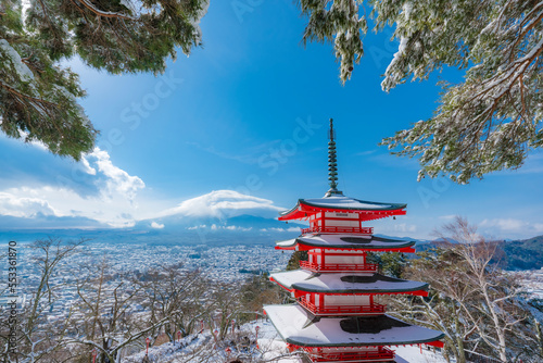 The Chureito Pagoda with the background of Mount Fuji during winter with cloud hat is cover