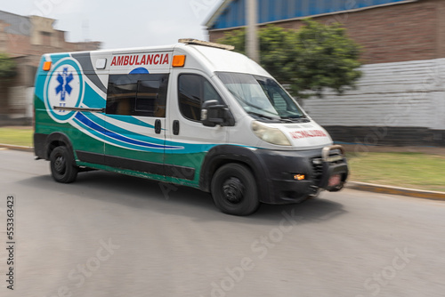 Motion photo of an ambulance speeding past