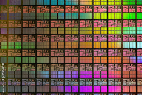 Semiconductor wafer with multiple dies and diffraction lighting shimmering rainbow of colors