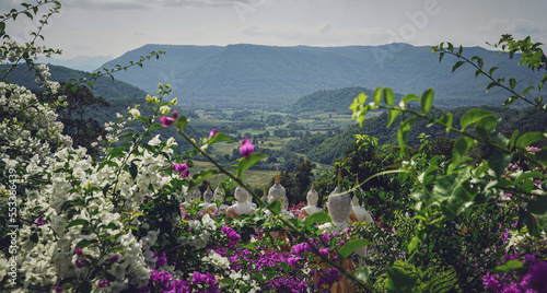 beautiful white stucco Buddha statue  enshrined on the hillside  It is a place of meditation called Wat Sutesuan, Nam Nao District, Thailand.