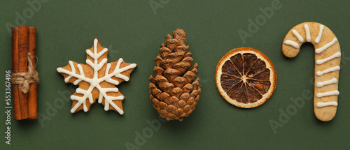 Beautiful Christmas composition with cookies and decor on green background © Pixel-Shot