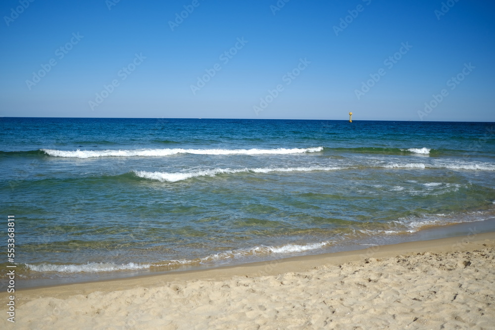 Blue sky and sea with waves