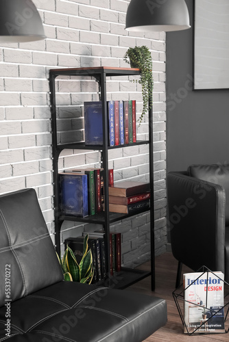 Shelf unit with books near ...