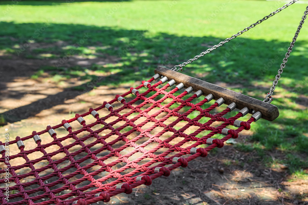 Comfortable hammock in garden on sunny day