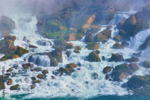 Niagara Falls up close on rocks with falls crashing over © Nicholas J. Klein