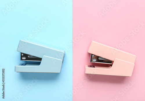Office staplers on color ba...