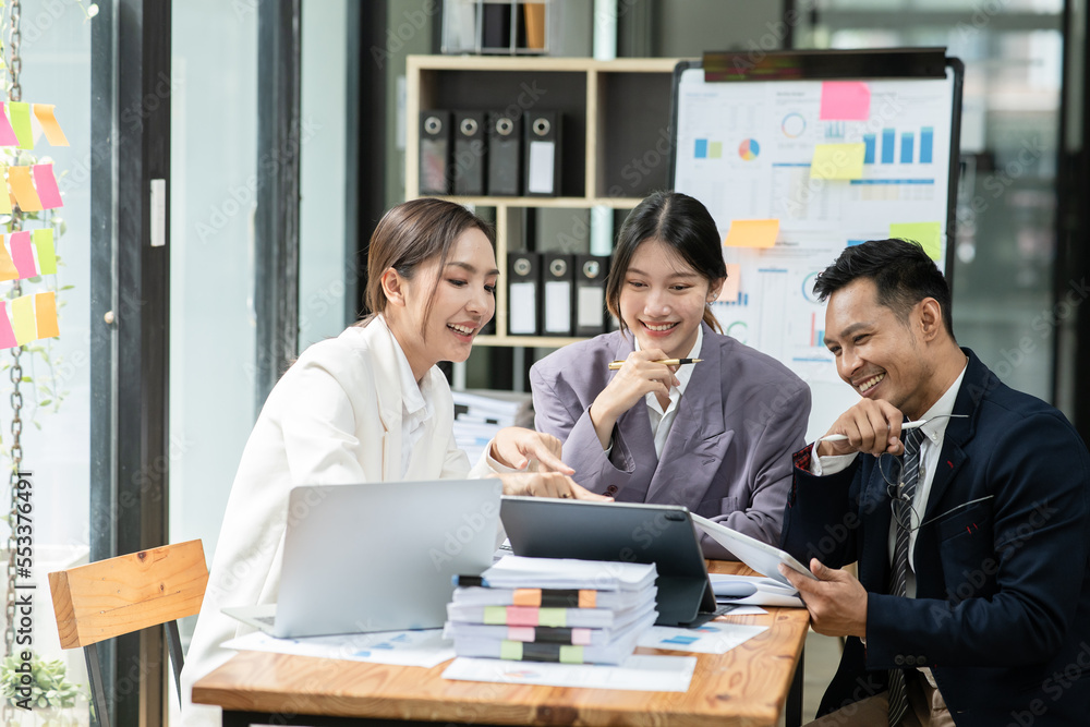 Group of asian business people working, discussing new projects together, having fun at the office. Group of asian business people working, discussing new projects together, having fun at the office.