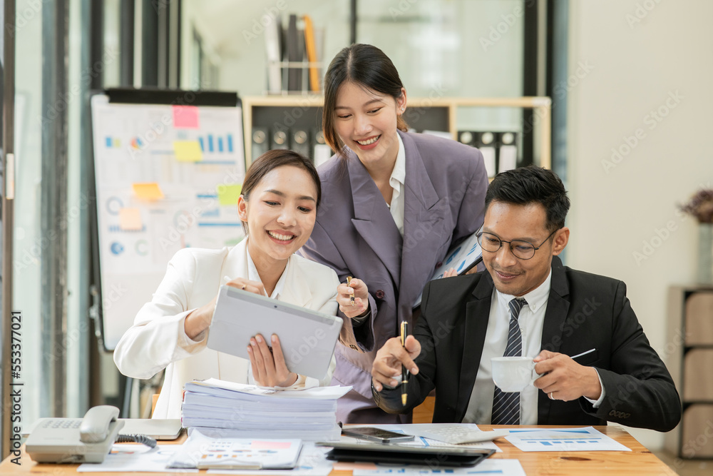 Fototapeta premium Group of asian business people working, discussing new projects together, having fun at the office.