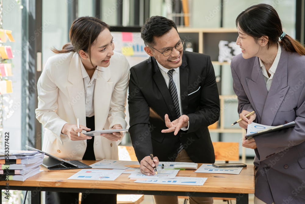 Group of asian business people working, discussing new projects together, having fun at the office. Group of asian business people working, discussing new projects together, having fun at the office.