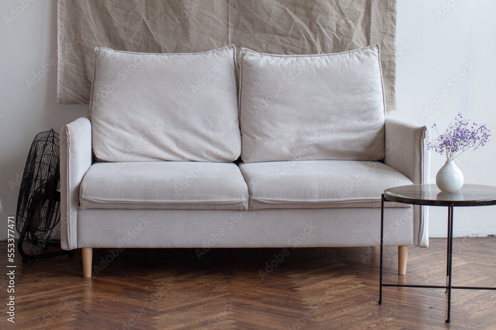 Retro interior with white sofa. White chair and wooden floor. Retro interior with white sofa. White chair and wooden floor.