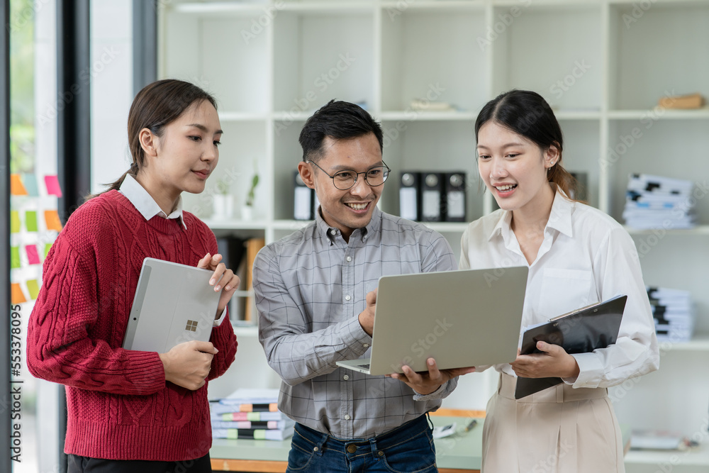 Group of asian business people working, discussing new projects together, having fun at the office. Group of asian business people working, discussing new projects together, having fun at the office.