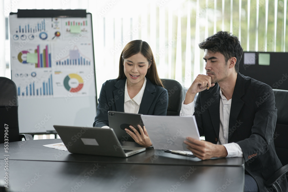 Group of asian business people working, discussing new projects together, having fun at the office. Group of asian business people working, discussing new projects together, having fun at the office.