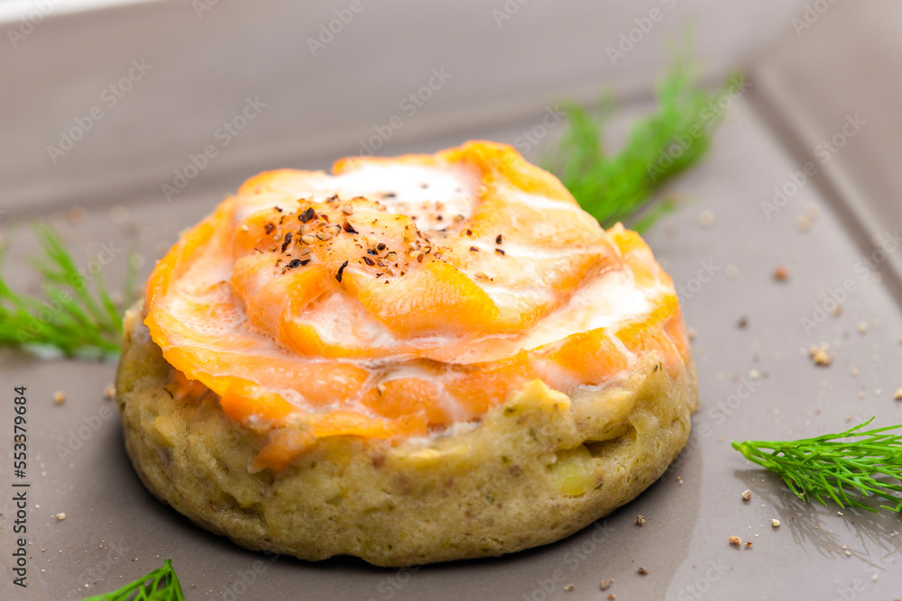 salty cake filled with cream cheese served with smoked salmon and dill
