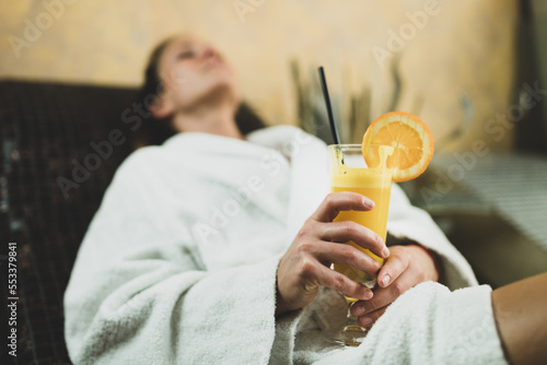 Woman Relaxing on a Warm Tepidarium Bed photo