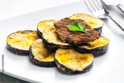 meat in breadcrumbs with grilled aubergine