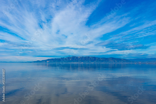 Delta del Ebro,  Catalonia in Spain- calm lake with clouds reflected in perspective photo