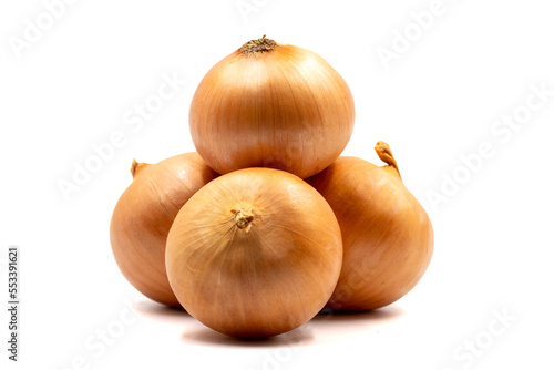 Ripe yellow onion isolated on a white background. pile of organic onions. clipping path, full depth of field