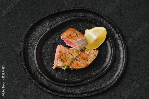 Overhead view of roasted tuna steak in a plate