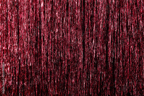 Metallic pink, red, magenta color foil tinsel fringe decoration curtain. Birthday, wedding, Christmas, New Year party decoration background photo