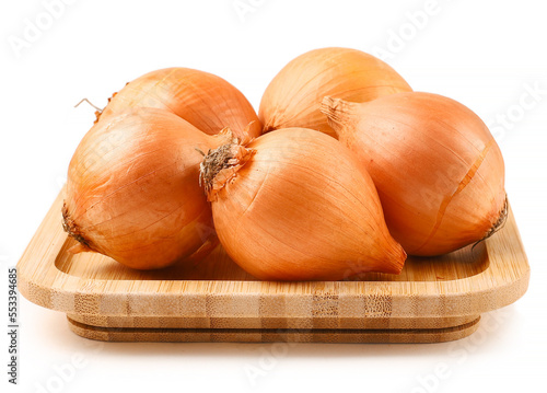Raw onion on wooden plate, white background